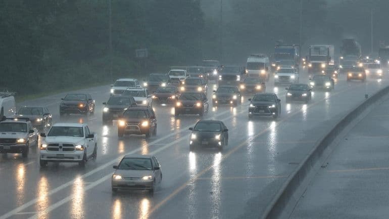 Eastbound traffic moves along the Long Island Expressway at Exit 49 in Melville as a heavy rain falls at approximately 4:00 p.m. on Thursday, July 31, 2025.